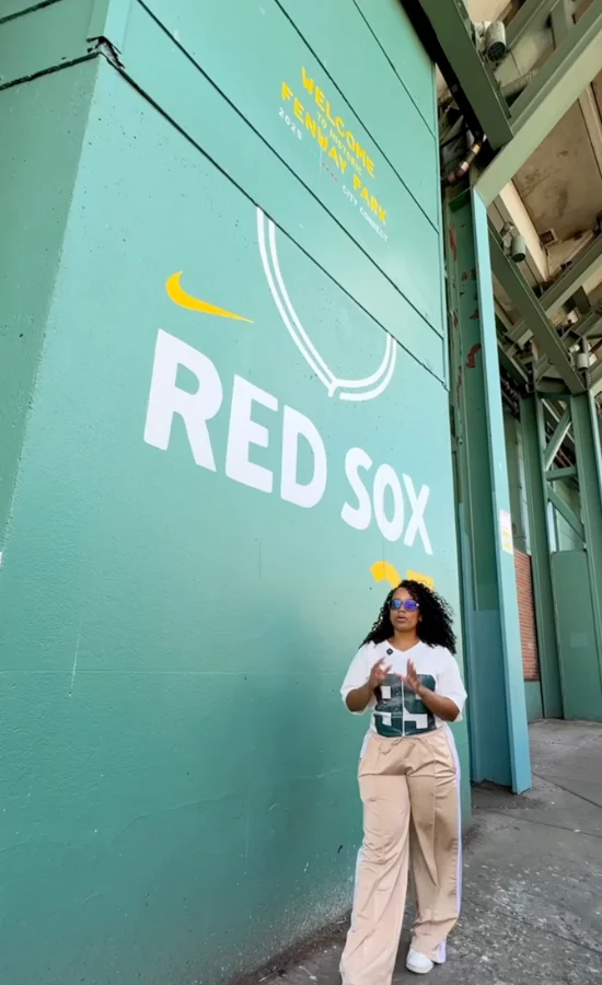 Red Sox fan creating content at Fenway Park